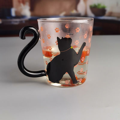 Qualität Borosilikat-Schwarze Katze-Tee-Glasbecher mit Farbschwanz-Griff usine
